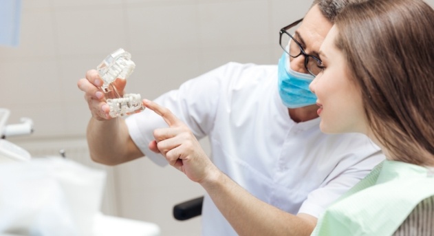 Dentist explaining the cost of dental emergencies