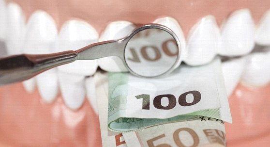 Money in a set of white teeth